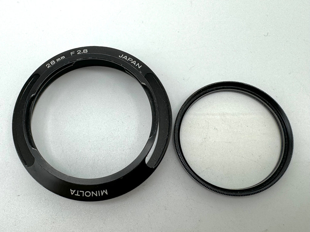 Used Minolta CLE Lens Hood for 28mm Lens and Minolta 37mm UV Glass Filter to suit.