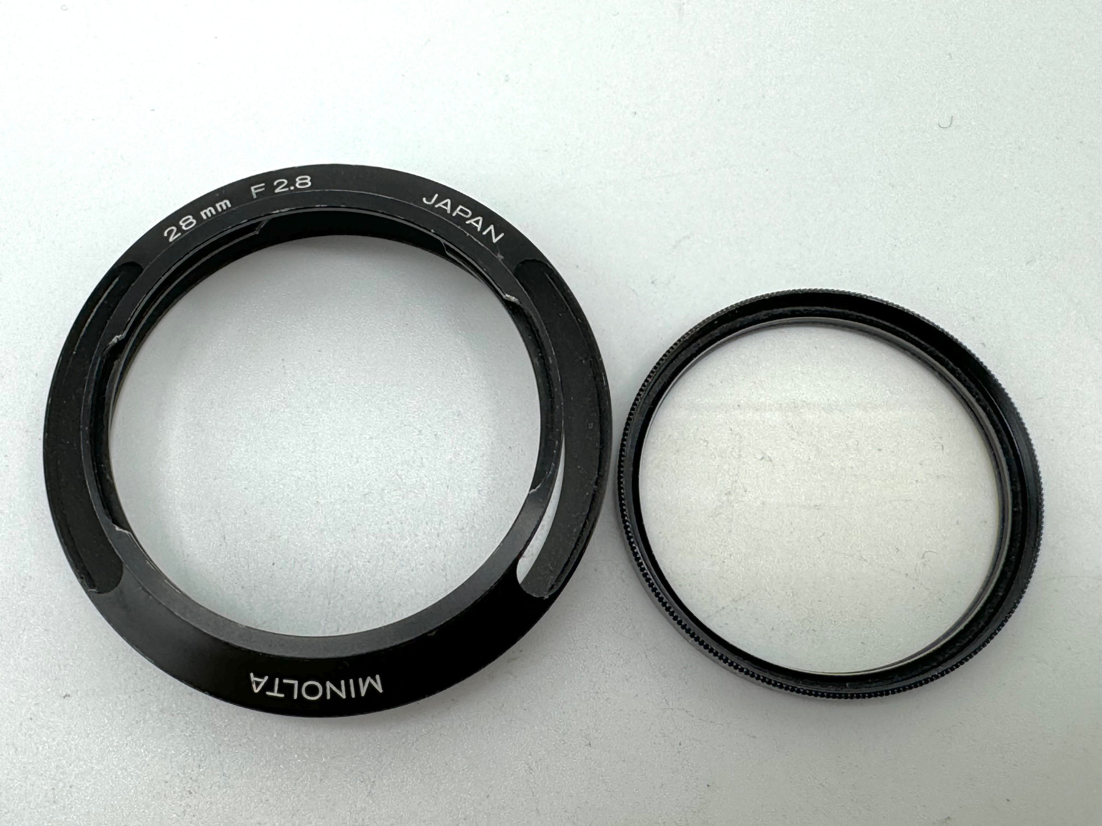 Used Minolta CLE Lens Hood for 28mm Lens and Minolta 37mm UV Glass Filter to suit.