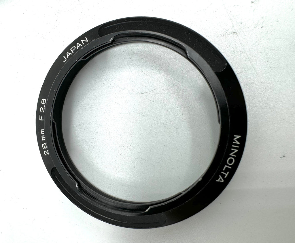 Used Minolta CLE Lens Hood for 28mm Lens and Minolta 37mm UV Glass Filter to suit.