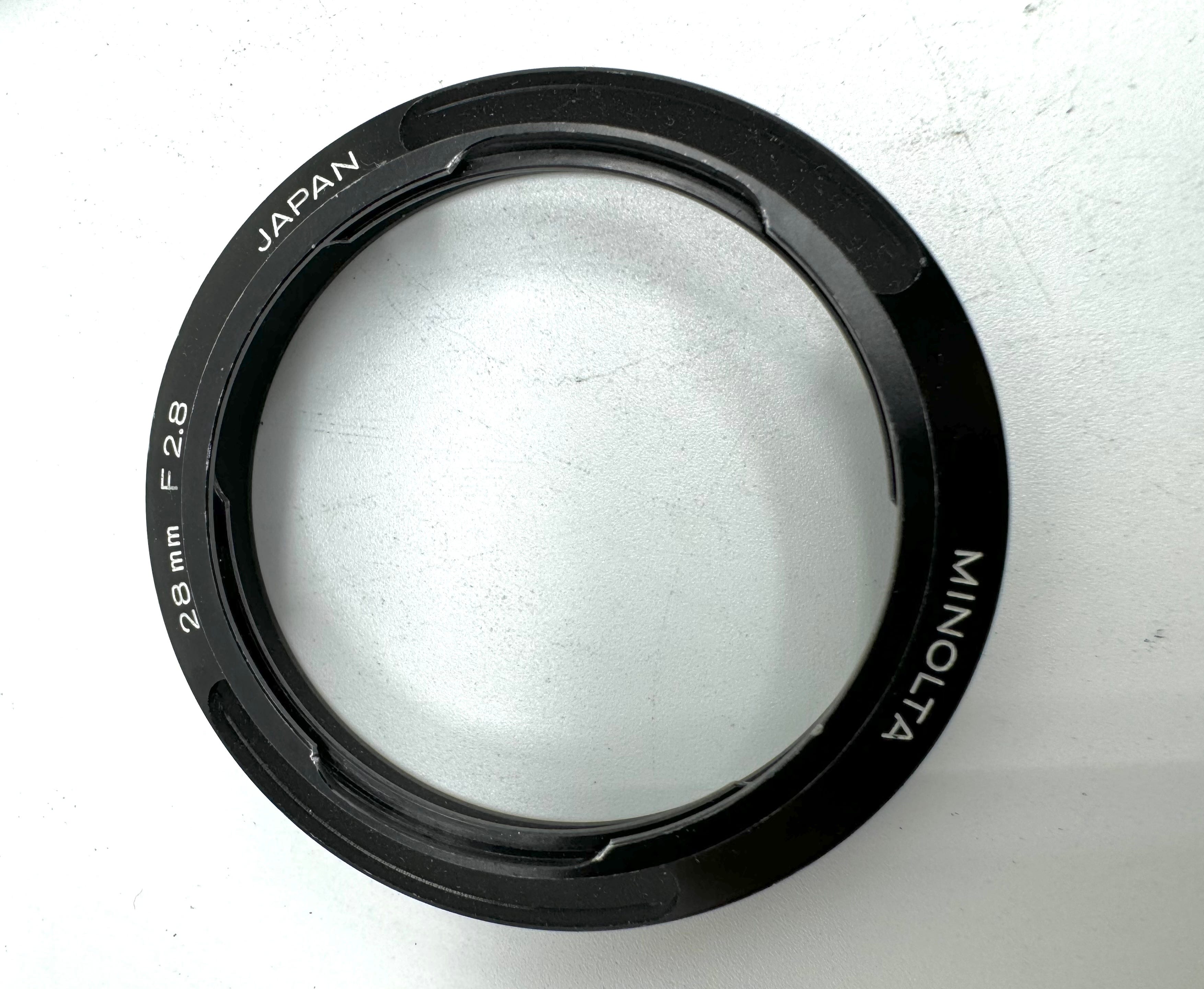 Used Minolta CLE Lens Hood for 28mm Lens and Minolta 37mm UV Glass Filter to suit.