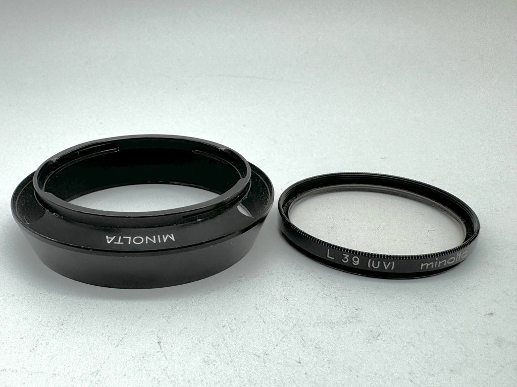 Used Minolta CLE Lens Hood for 28mm Lens and Minolta 37mm UV Glass Filter to suit.