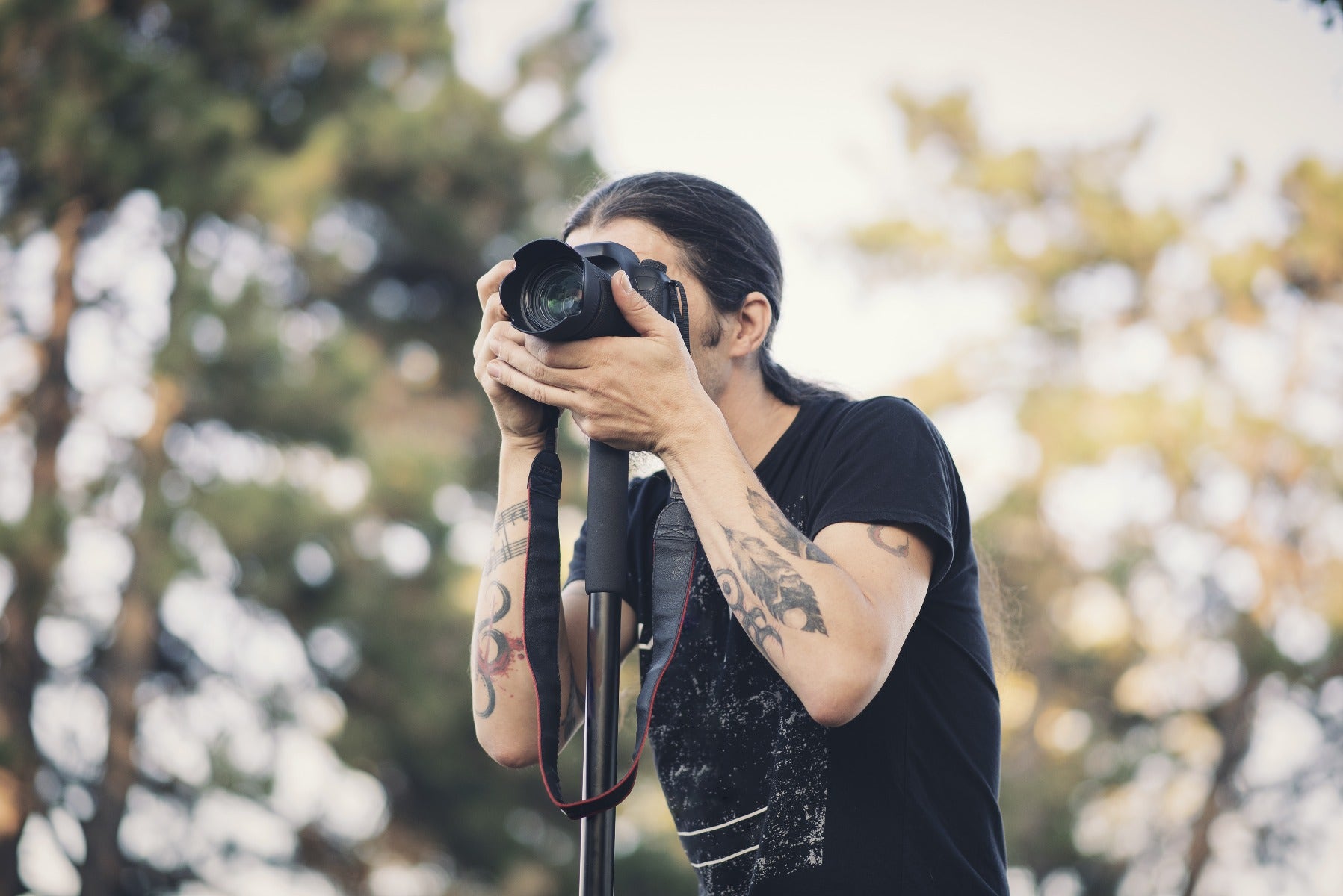 Man using a camera monopod