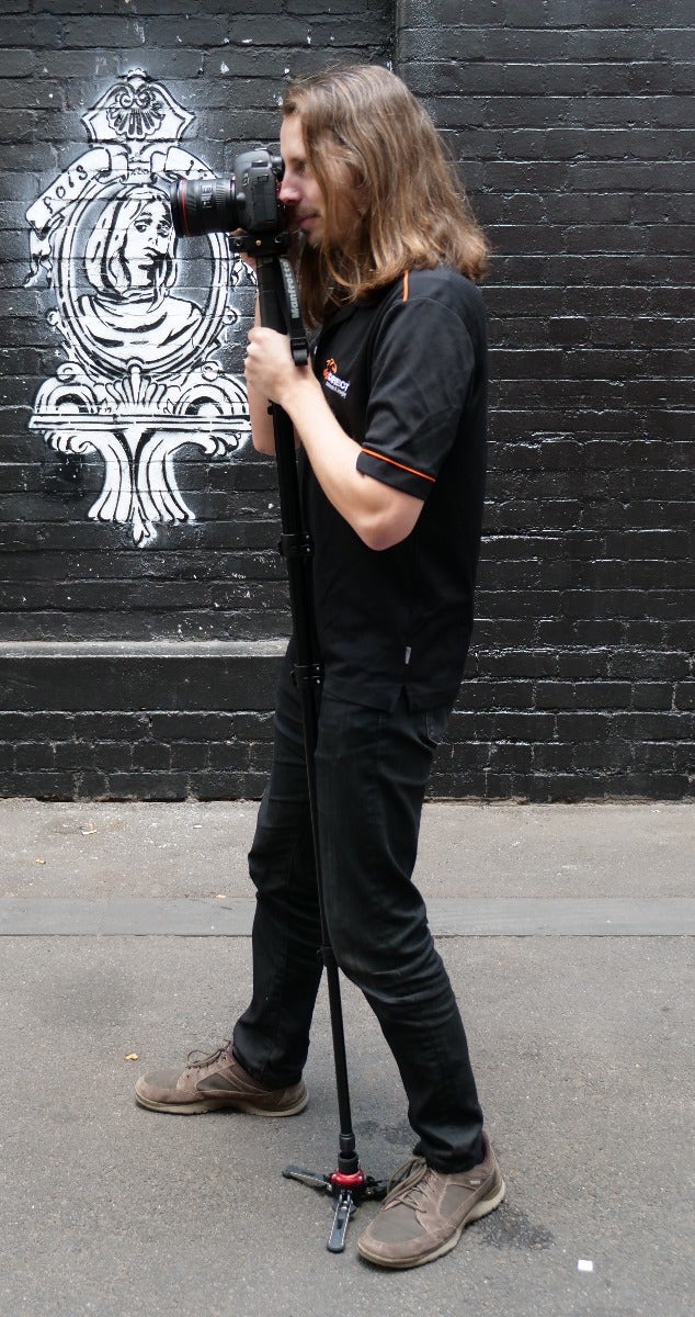 Holding a monopod, position 2 - profile