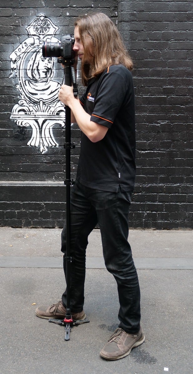 Holding a monopod, position 3 - profile