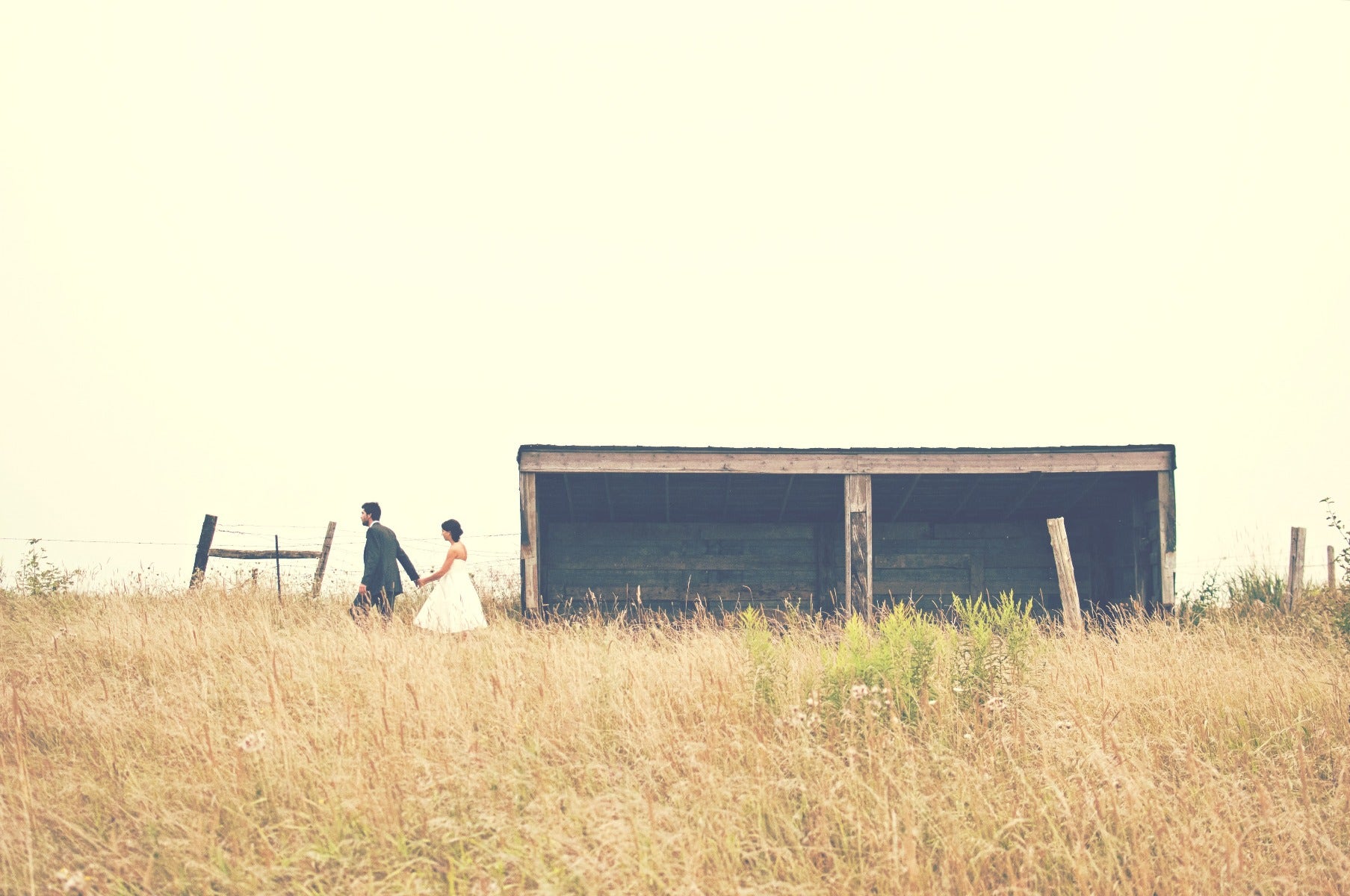 Bride & Groom in a field with shack