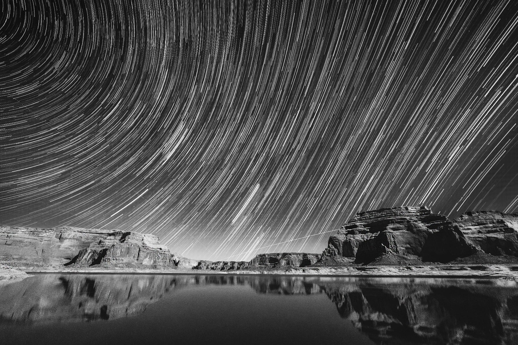 Star trails over body of water