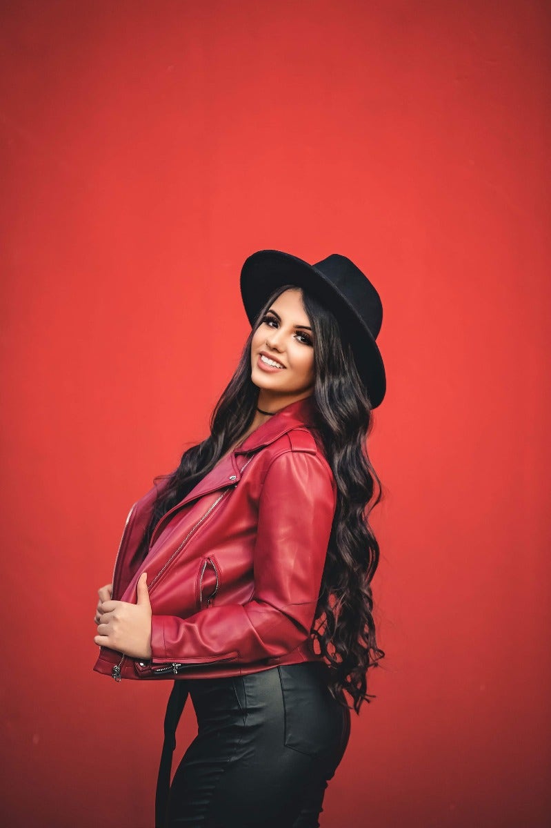 Portrait of woman with red background