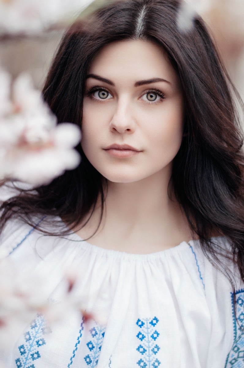 Woman with foreground flowers