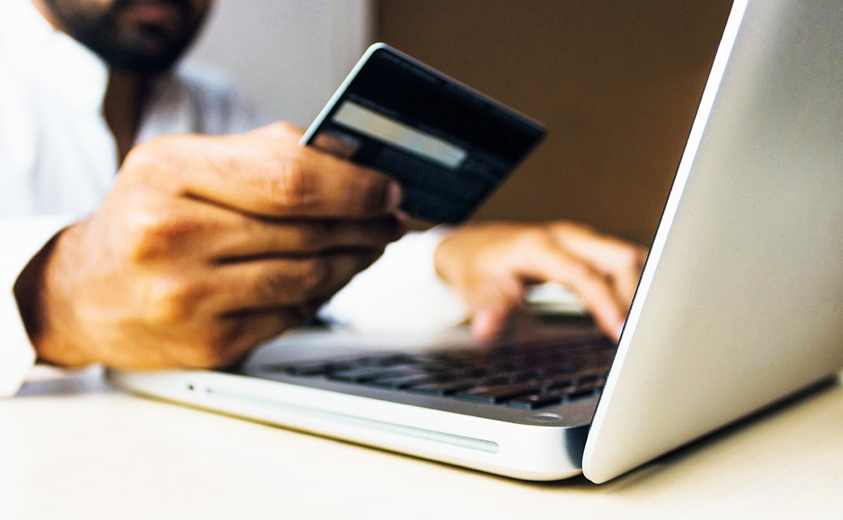 Man purchasing on his laptop