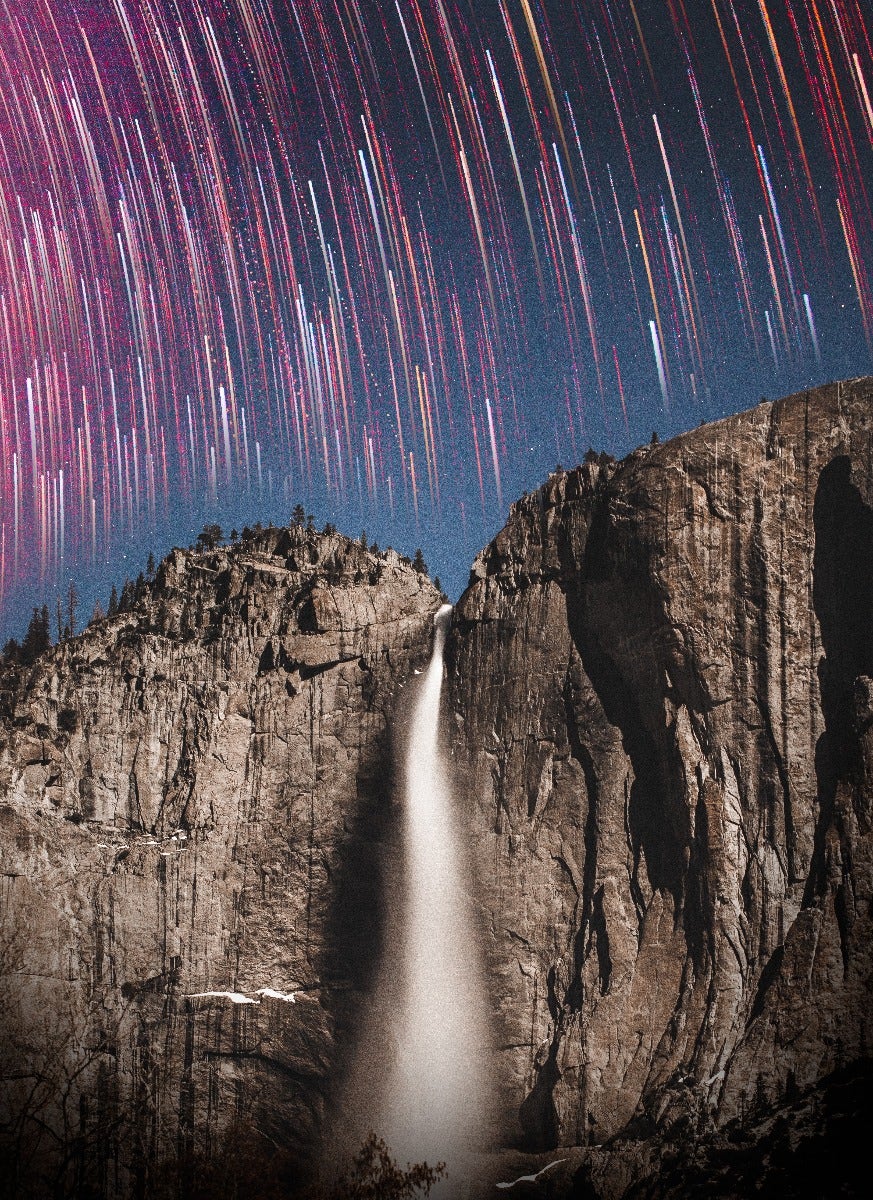 Star trails over waterfall